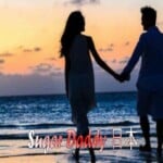 男と女は夕暮れ時にビーチを歩く