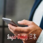 携帯電話を持つ手